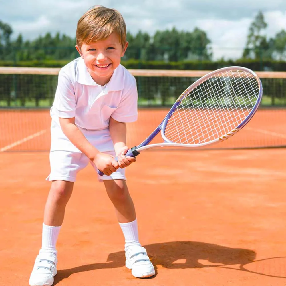A racquet and a ball resting on the court surface