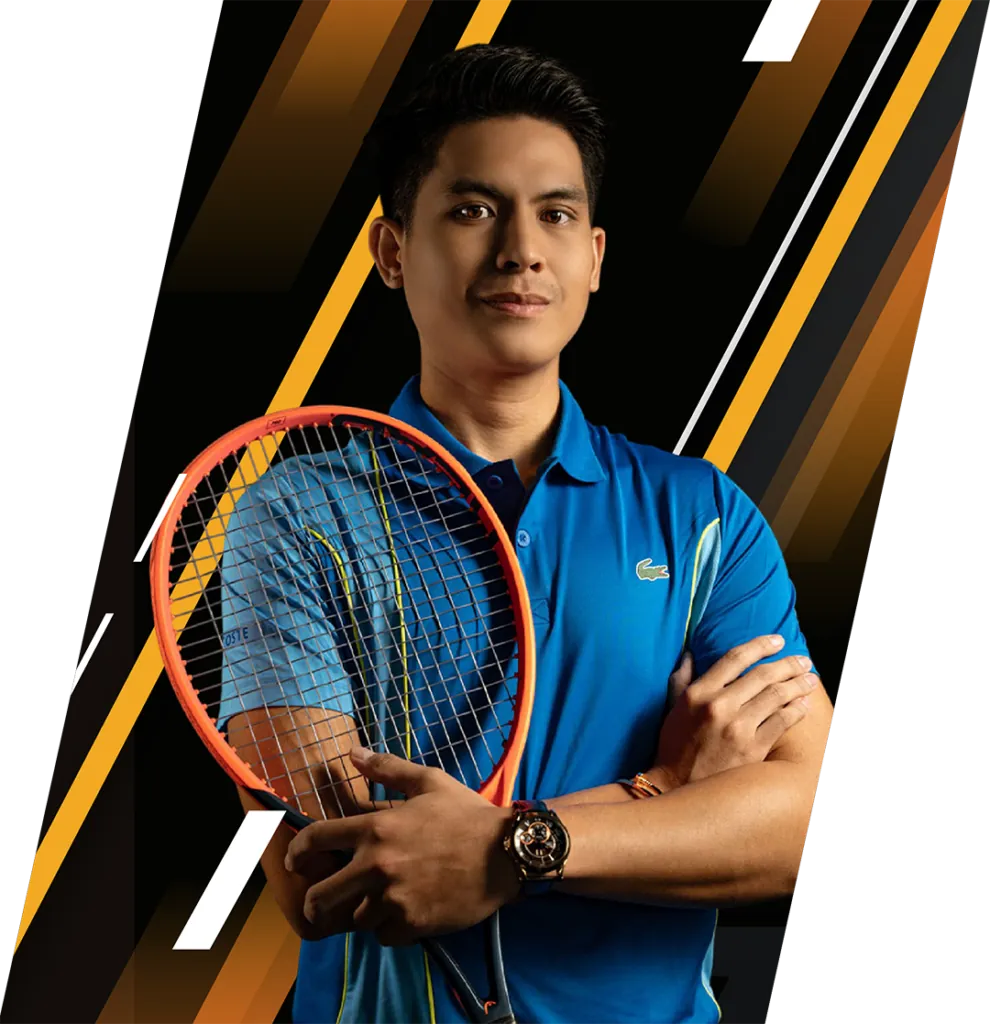Coach Marc Norman Cavan Enriquez holding a racquet, arms folded