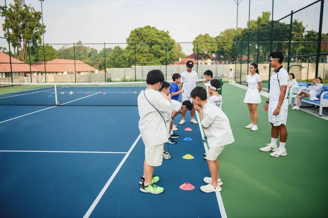 Young players stepping between coloured spot markers